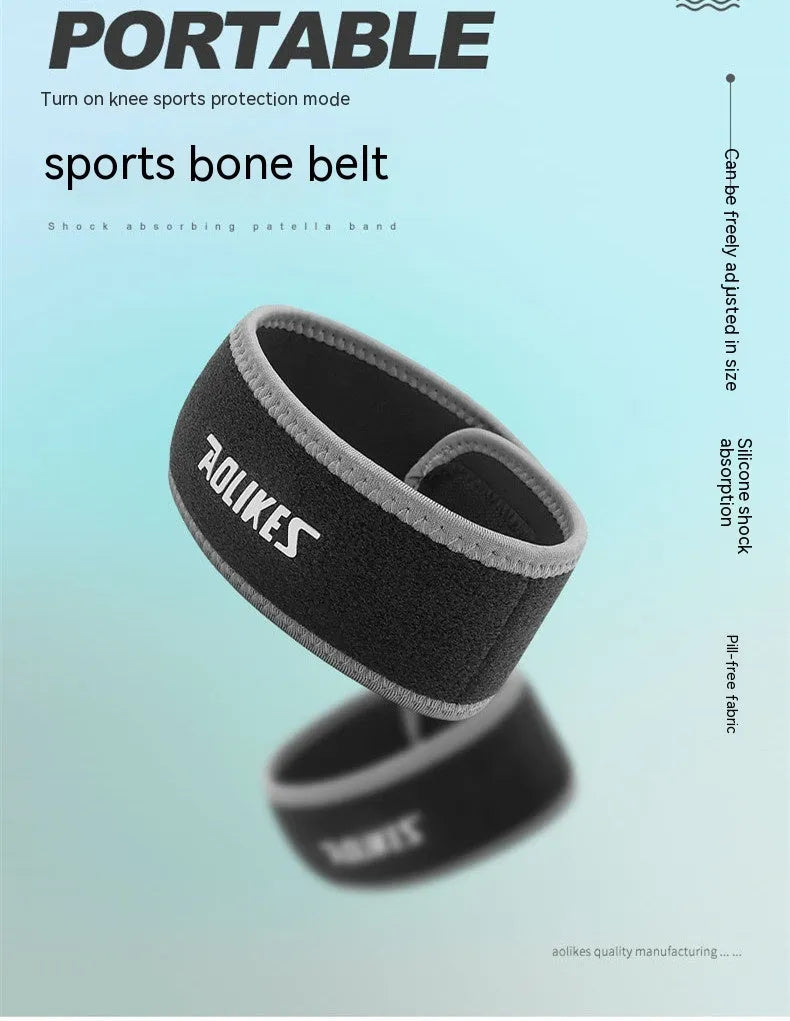 Black and grey patella retinaculum knee support strap for adult sports use.