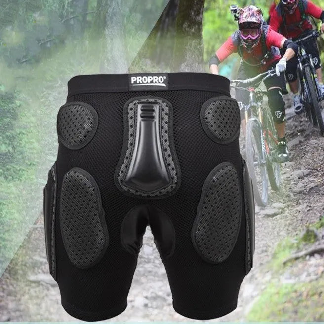 Black cycling hip protection pants showing hip pad placement, labelled with available sizes S, M, L, XL.