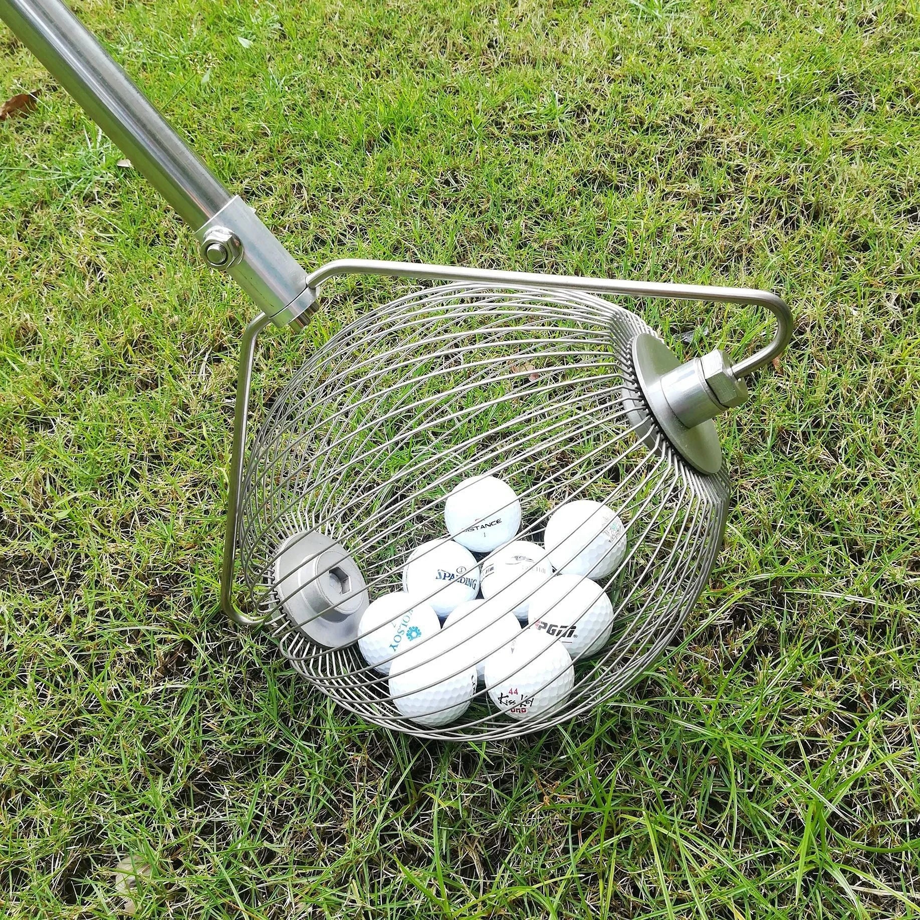 Handheld stainless steel golf ball picker retriever tool in metal colour.