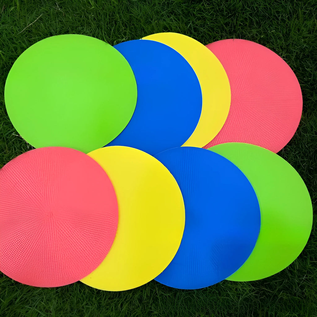 Soft coloured football training marker disc on grass field for target practice