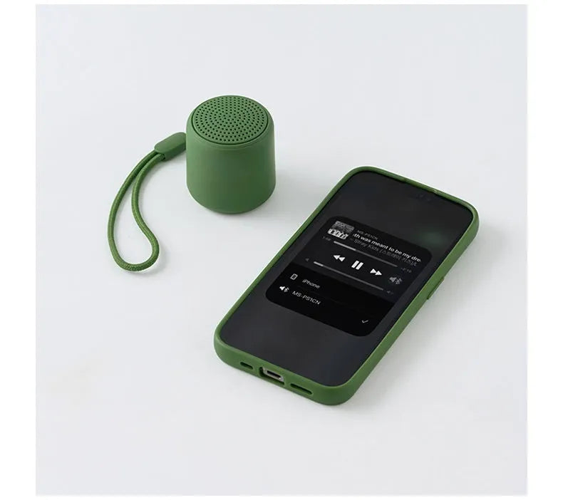 Mini portable wireless Bluetooth speaker in black with rounded edges and fabric grille, 45x48mm size
