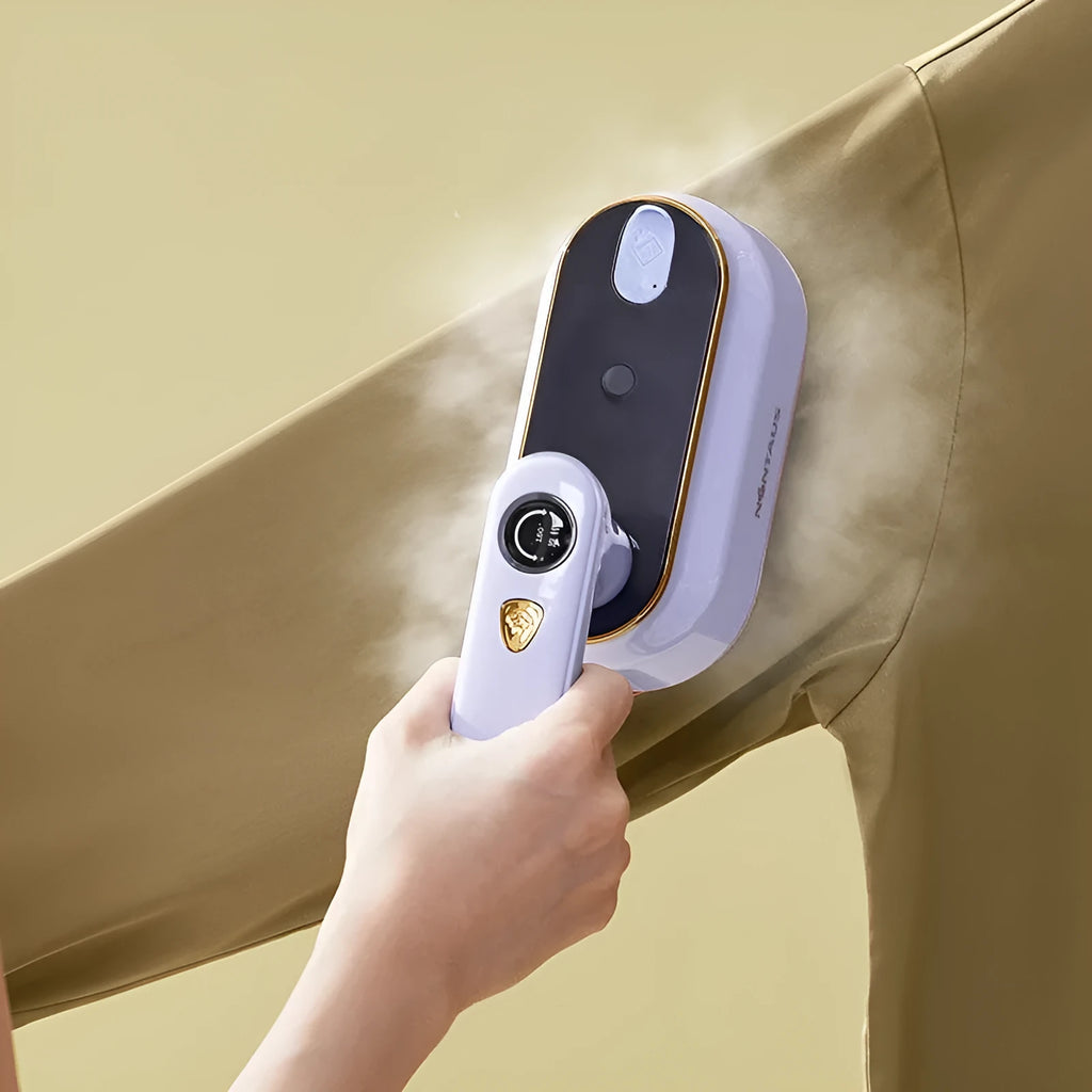 Milky white foldable portable steam iron with ceramic soleplate and international plug adaptors.