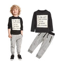 Boys' blue cotton two-piece set with long sleeve t-shirt and pants featuring a white letter print.