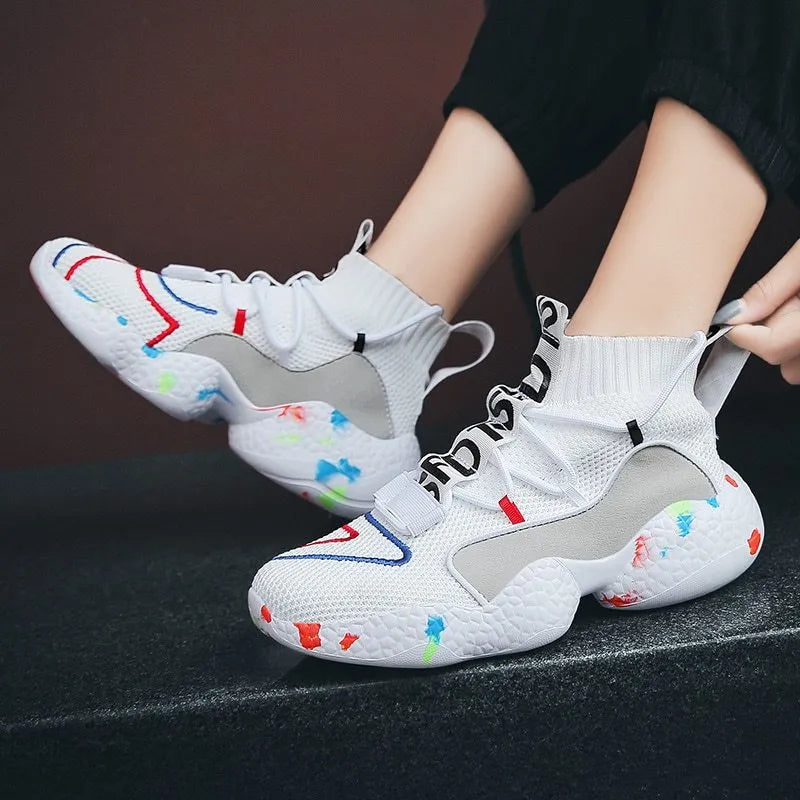 Men's camouflage pattern sneakers with mesh upper and flat vulcanised rubber sole.