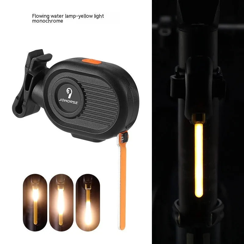 Bicycle tail light with colourful running water LED effect mounted on a bike seat post.