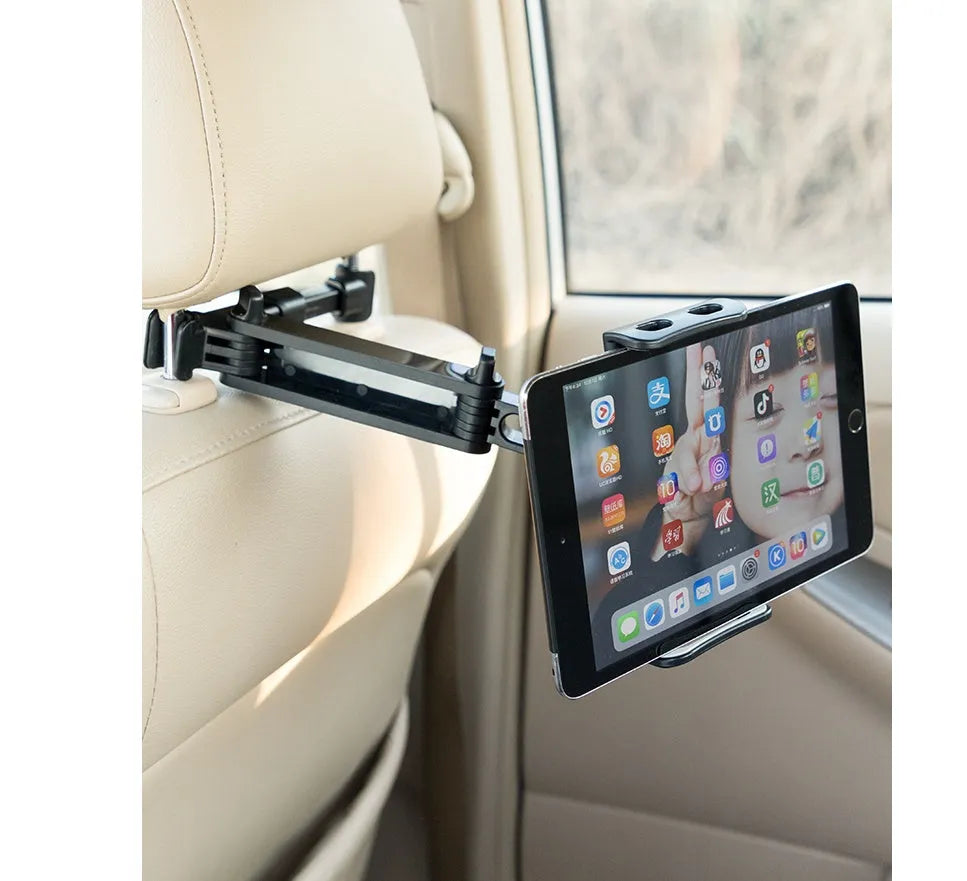 Black car phone holder mounted to rear seat base holding tablet for navigation