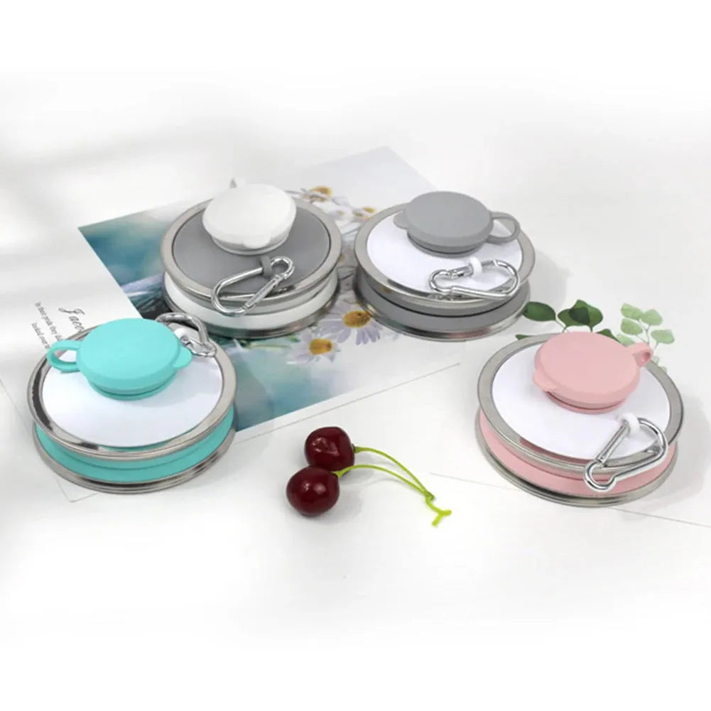 Collapsed and unfolded 500ml silicone travel cup in various colours with lid and carry hook
