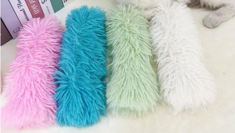 Soft plush cat toy pillow for stress relief in green, white, blue, and pink colours.