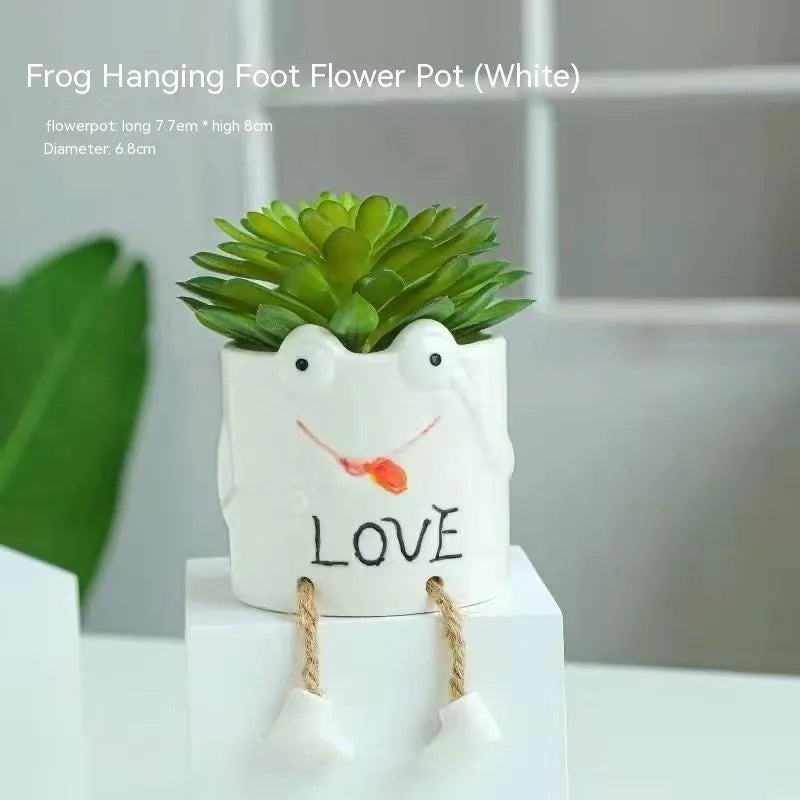 Cartoon style ceramic hanging foot flowerpot for succulents on a desktop