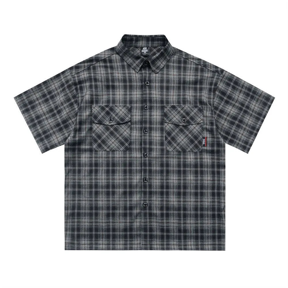Men's black and brown plaid shirt with embroidered letter detail on chest, short sleeves, lapel collar