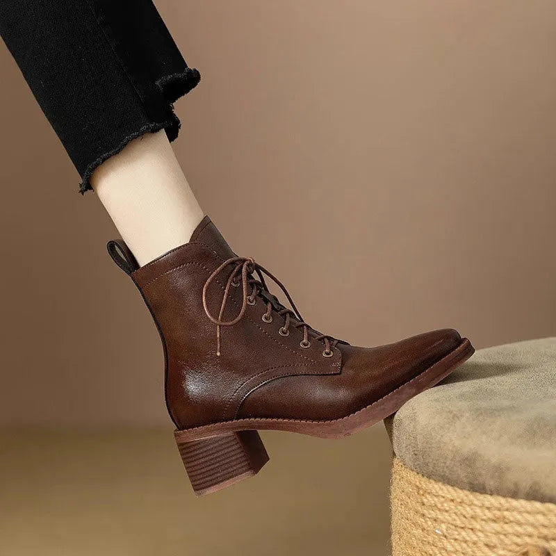 Black pointed-toe women's short tube ankle boots with a 5.5cm heel on a white background.