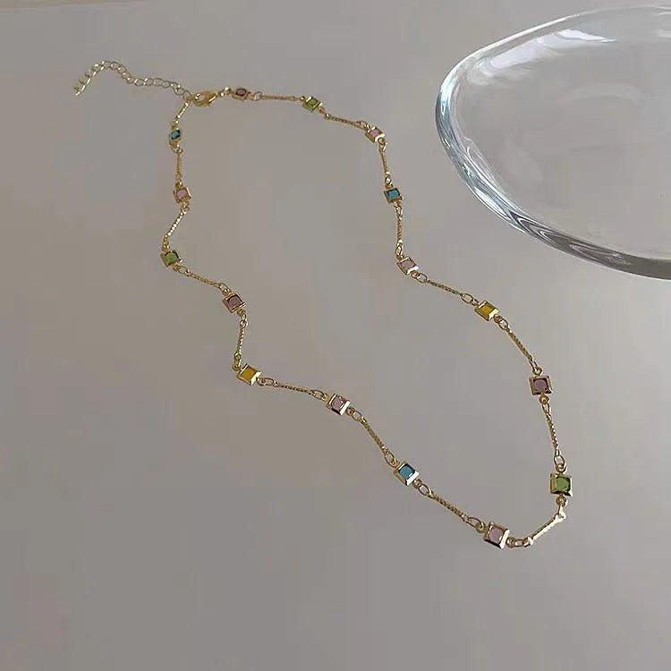 Square colour geometric clavicle chain necklace with quadrilateral artificial crystal pendant in gold alloy finish