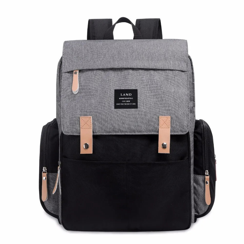 LAND Mommy large capacity oxford cloth diaper backpack with changing mat in beige colour.