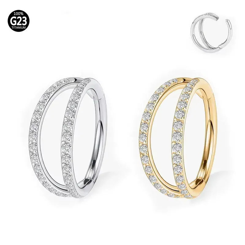 G23 titanium alloy nose ring with zircon accent in steel colour on a grey background.