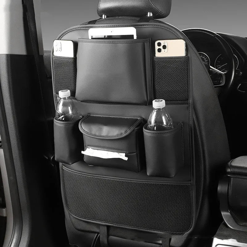 Leather car seat back storage bag hanging from vehicle headrest with multiple compartments