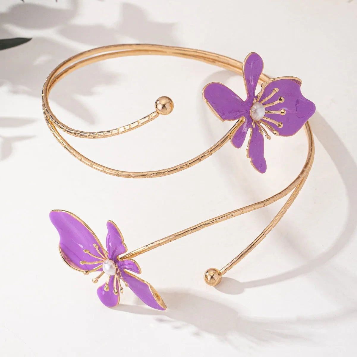 Pink and purple alloy armband with hollow linear pattern design and adjustable fit