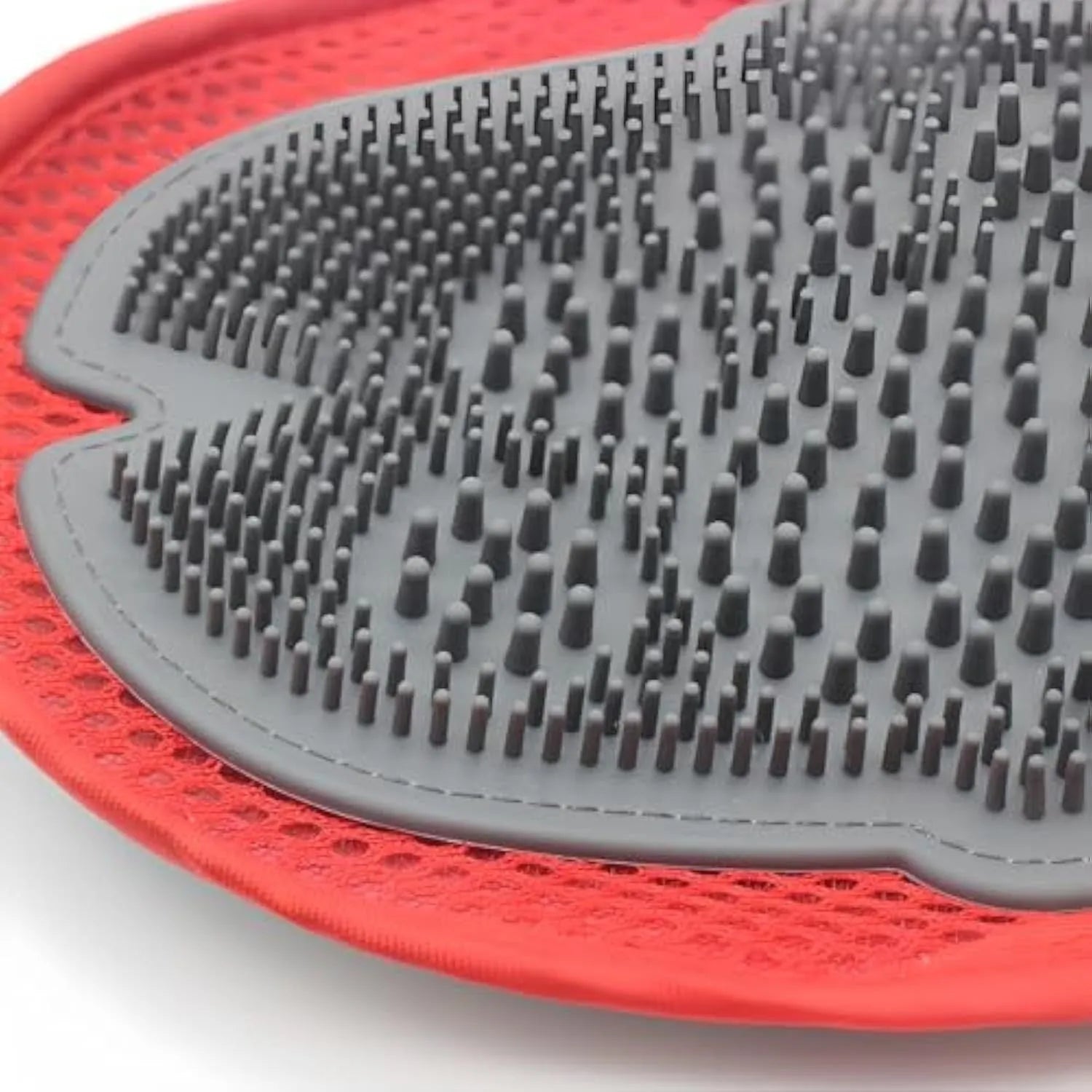 Red pet bathing glove with integrated brush surface for grooming dogs and cats