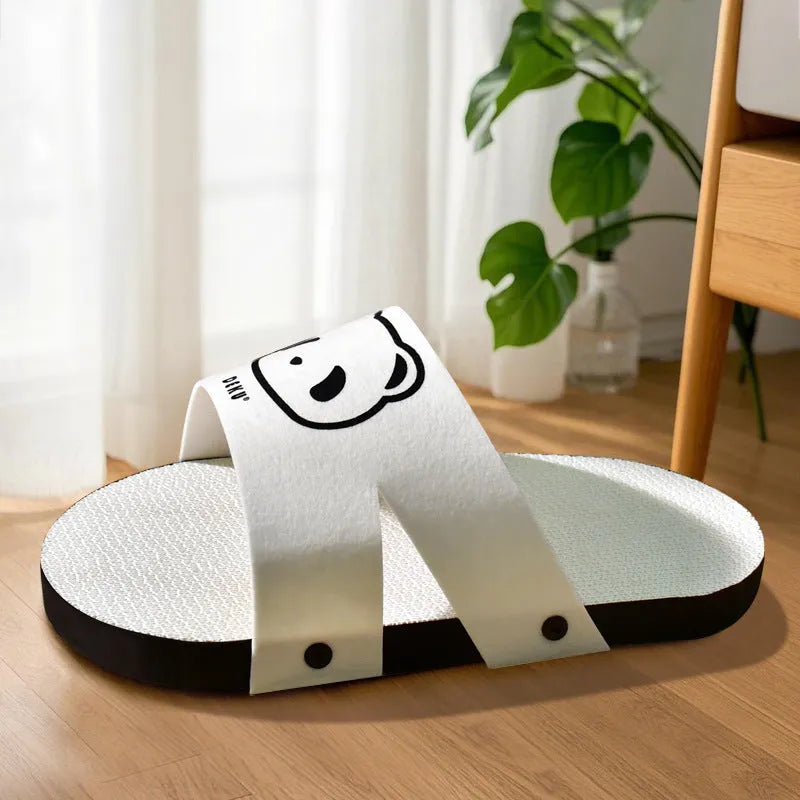 White corrugated paper cat scratch board designed in a slipper shape.