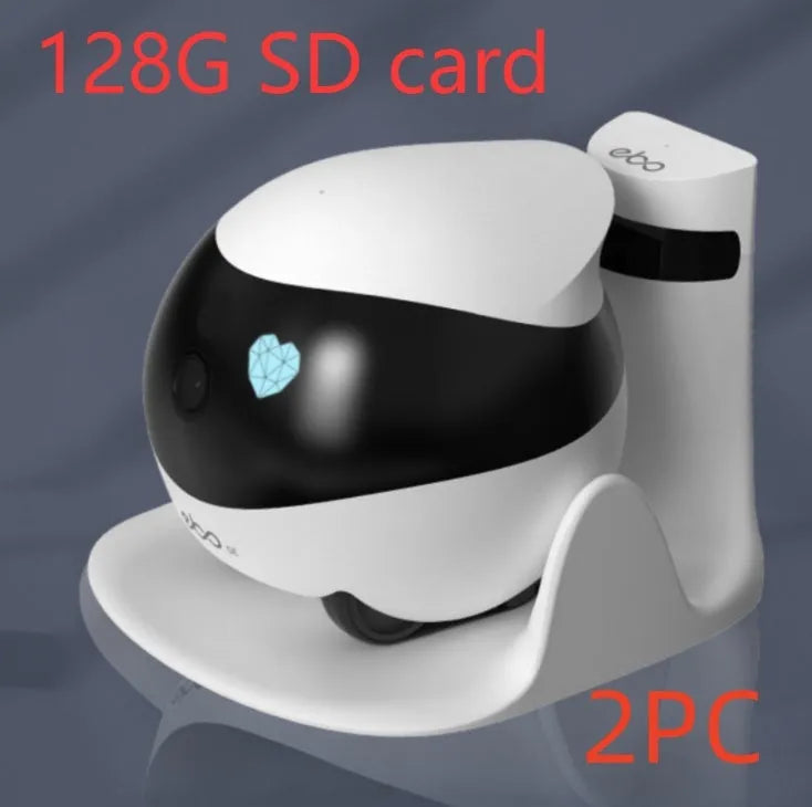 White smart home mobile surveillance robot camera on a charging dock.