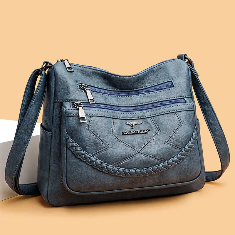 Soft leather shoulder bag in horizontal square shape with large capacity and internal zipper compartment