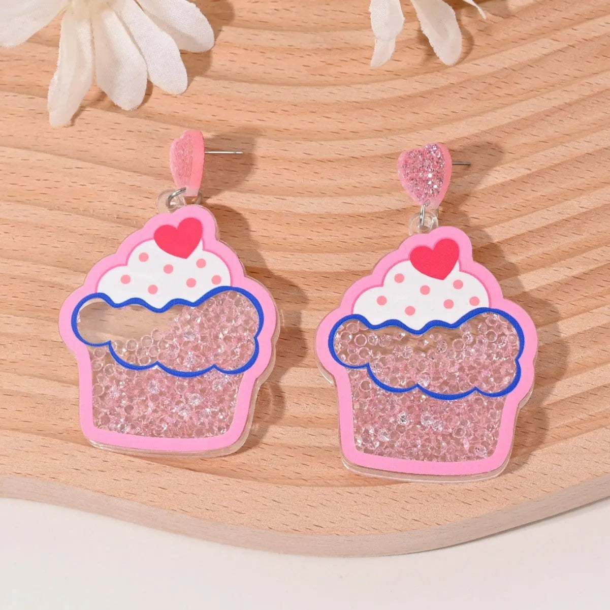 Colourful acrylic stud earrings with cherry, strawberry, watermelon, pineapple, coconut, cake, and ice cream designs.