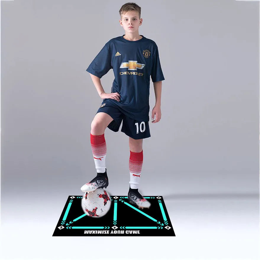 Black rectangular football training mat measuring 60cm by 90cm on a flat surface.