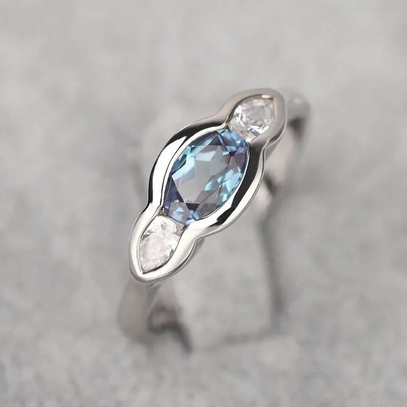 Geometric ellipse copper ring with inlaid zircon stones in white gold colour finish