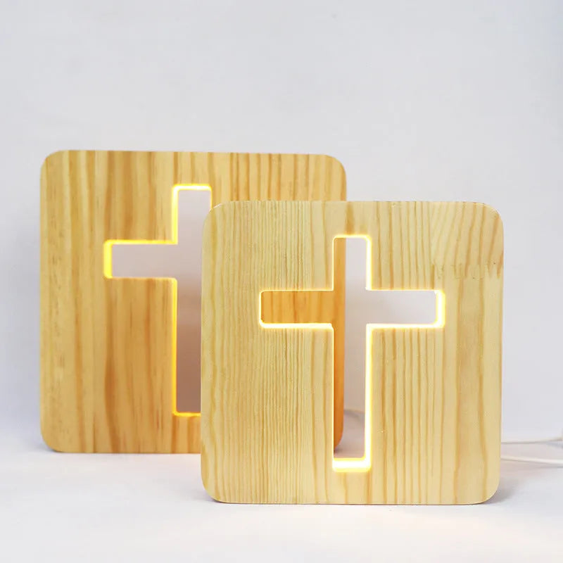 Solid wood hollow LED night lamp warm white with USB cable on wooden surface