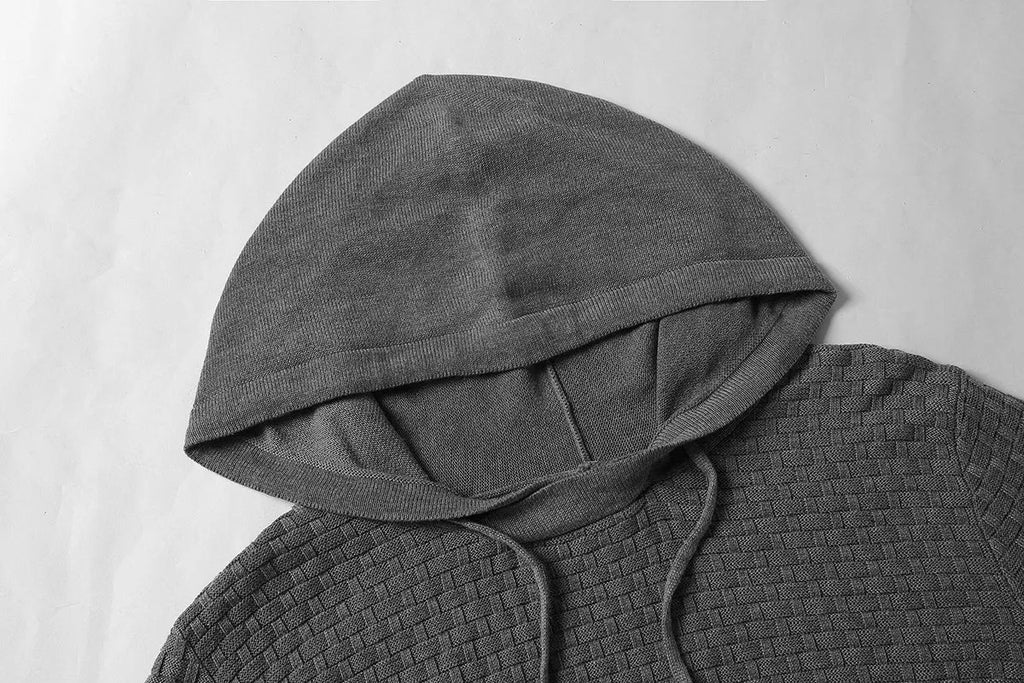 Men's grey cotton-polyester blend hooded sweatshirt on a hanger, showing front design and hood.