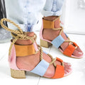 Women's beige suede sandals with thick heel and front strap.