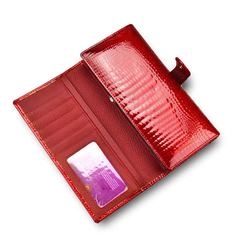 Women's red leather coin purse with crocodile pattern texture and a visible interior pigskin lining.