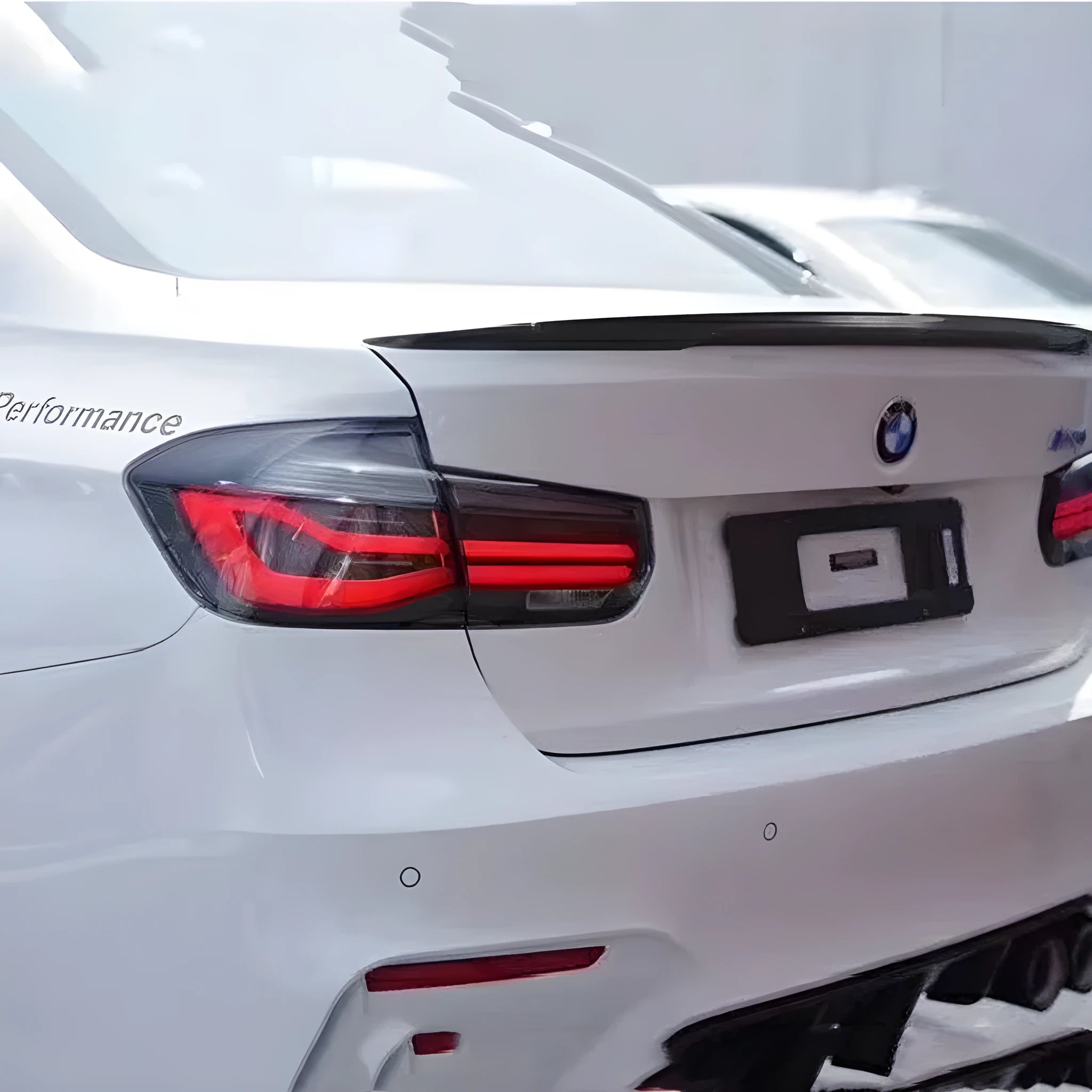 BMW 3 Series aftermarket LED tail light assembly with streamer design in red or smoked black finish.