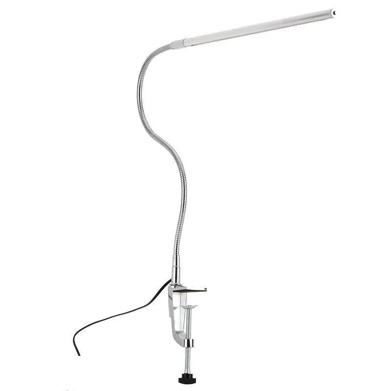 Silver aluminium USB-powered clip-on LED table lamp with a long arm extended, for nail art and detailed tasks.
