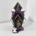 Wooden haunted house Halloween decoration measuring 14x10.5x19cm for candle illumination