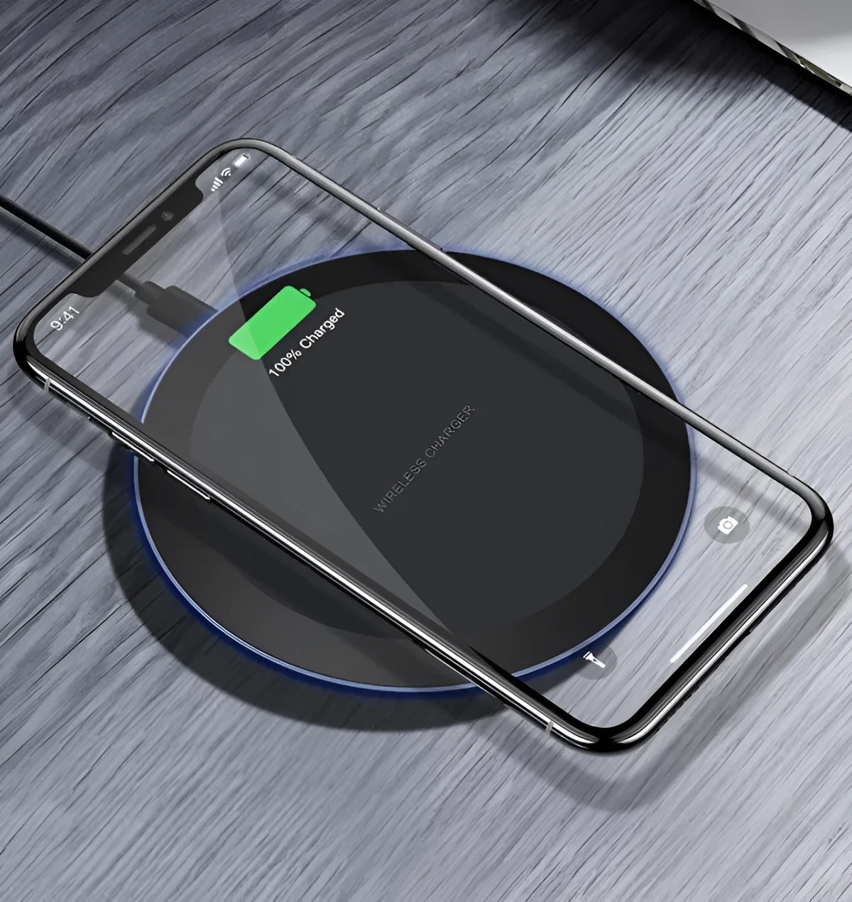 10W/5W black fast wireless phone charger pad on desk with iPhone - 100mm diameter, 8mm thick