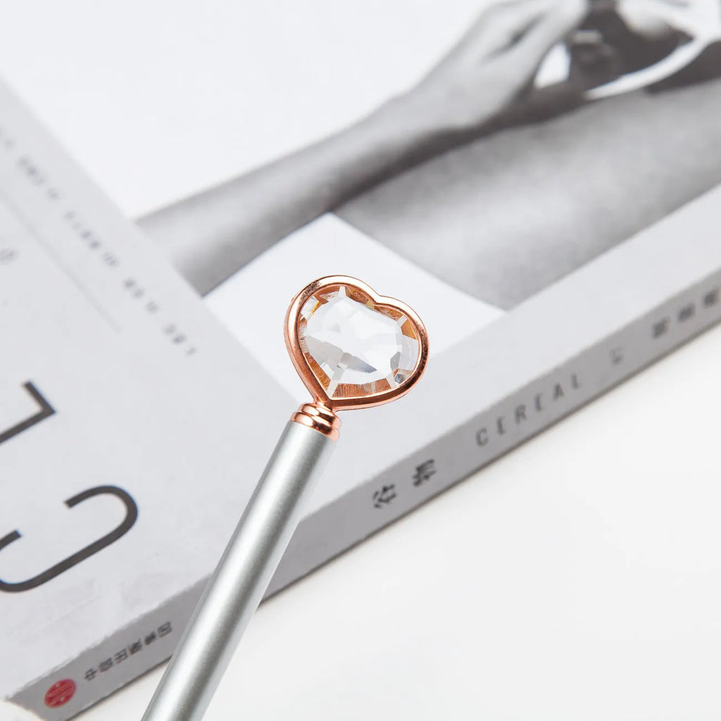 Creative Crystal Love Ball diamond metal pen in rose gold on a white background