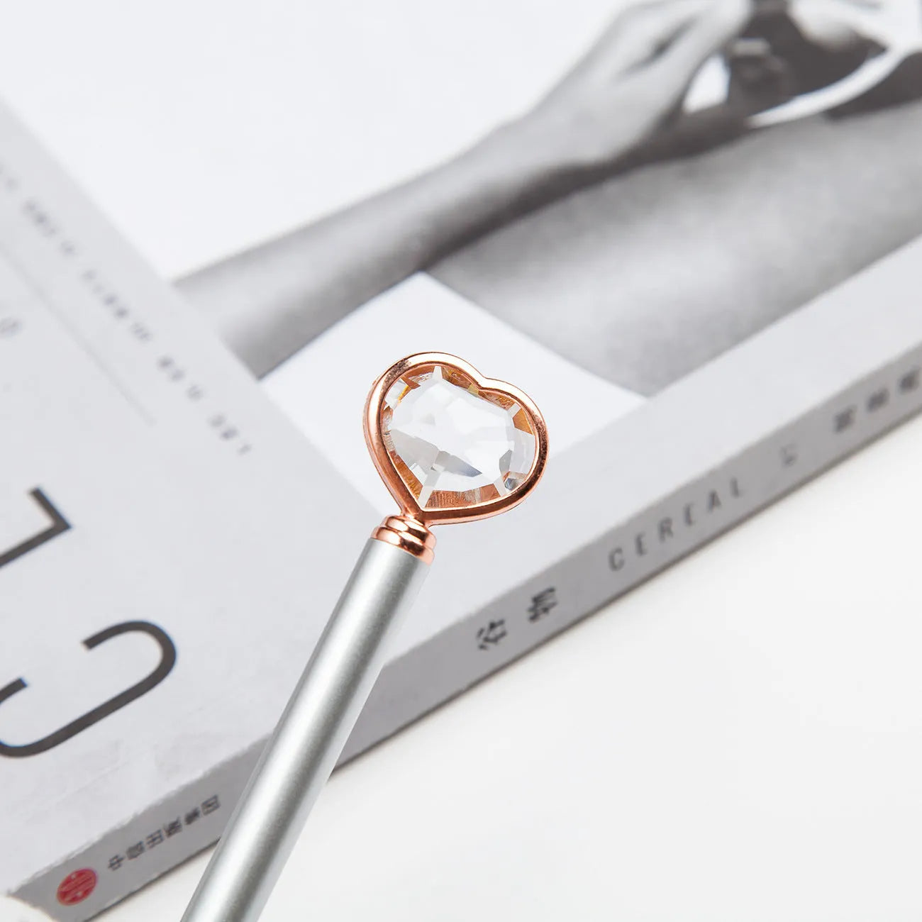 Creative Crystal Love Ball diamond metal pen in rose gold on a white background