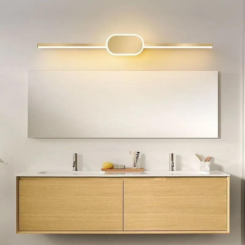 Gold-framed rectangular bathroom mirror cabinet with integrated LED light strip around the edge.