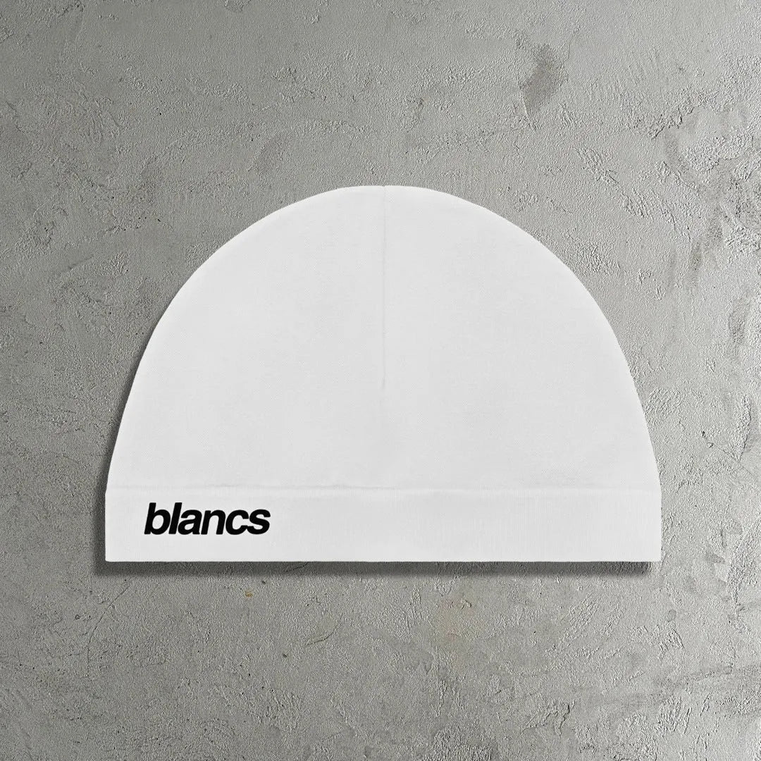 White polyester cap with embroidered letter detail, front view