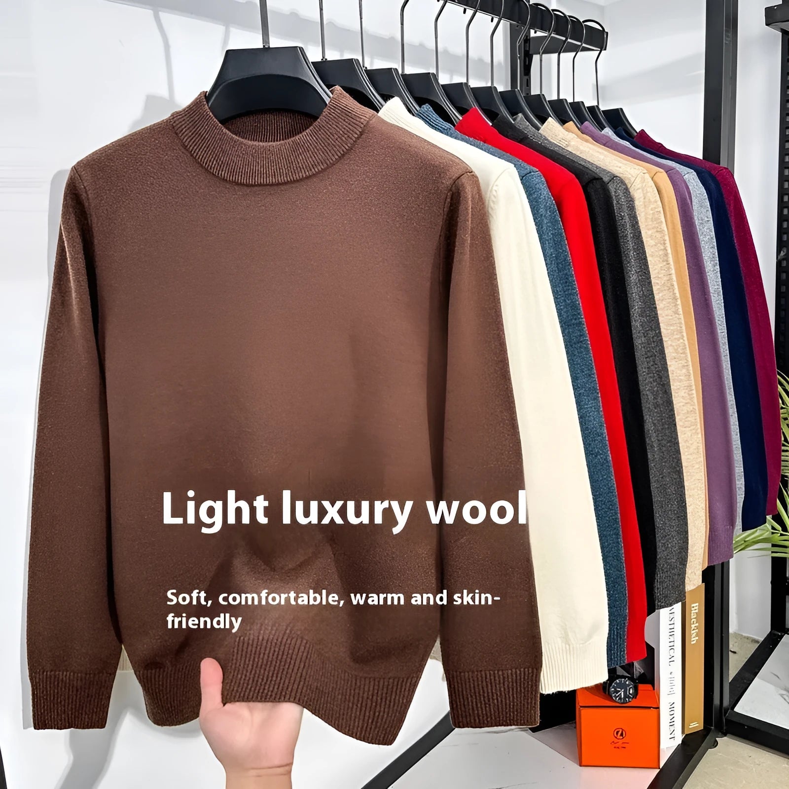 Men's fine yarn wool half turtleneck pullover sweater in a solid colour on a hanger.