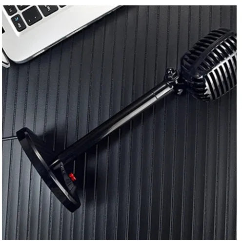 Black USB condenser microphone on an adjustable stand for computer recording and podcasting.