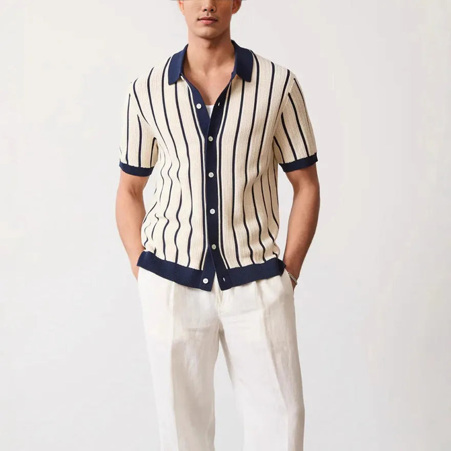 Men's white asymmetric short sleeve knitted top with a lapel collar on a model.