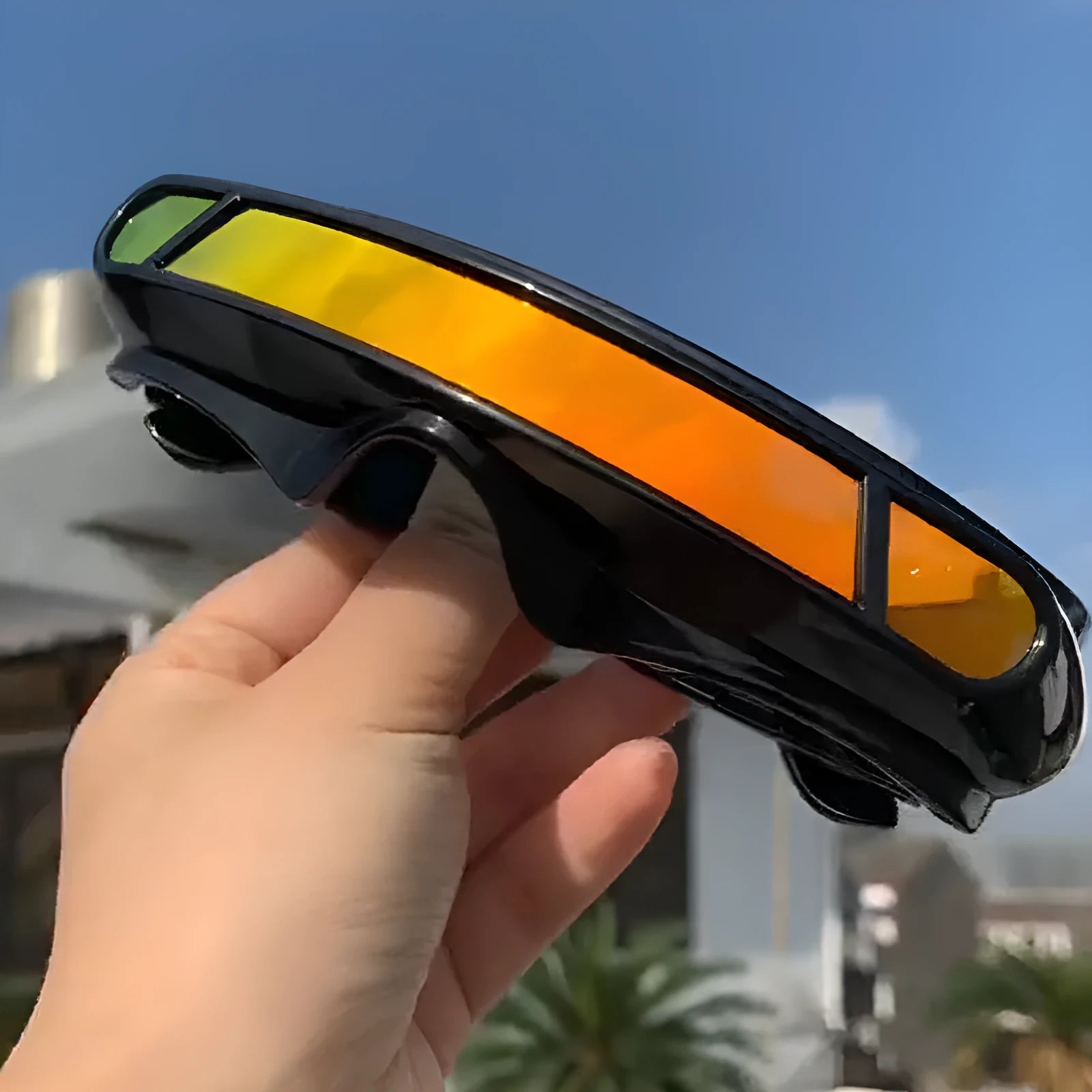 Polarised sports sunglasses with a black full-rim PC frame and choice of grey, red, or blue mirror lenses.