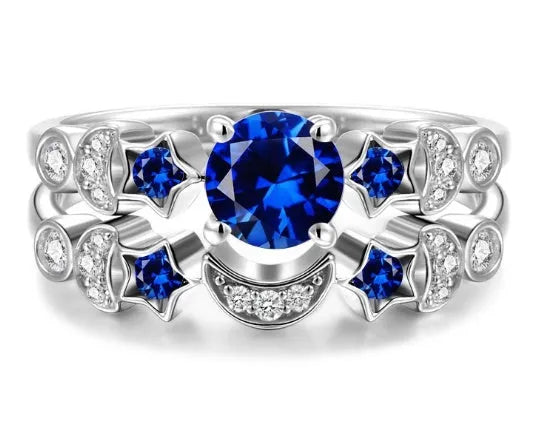 Creative moon ring with blue gemstone inlay on display showing detailed crescent design and stone setting.