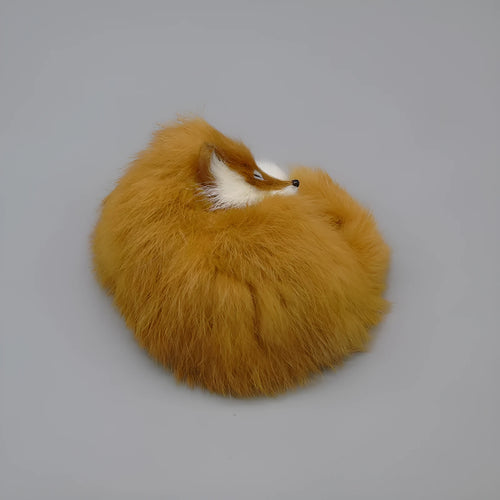 Artificial white fox fur handicraft decoration on a car dashboard, showing its 15cm size.