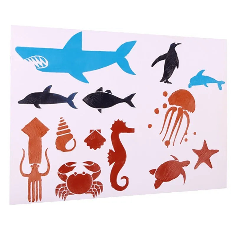 White plastic drawing stencil set with cut-out patterns for craft tracing.