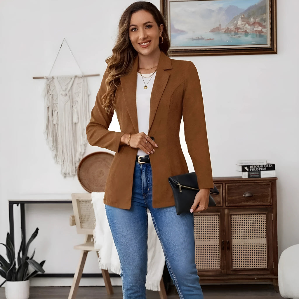 Brown men's single-breasted lapel blazer with long sleeves on a hanger.