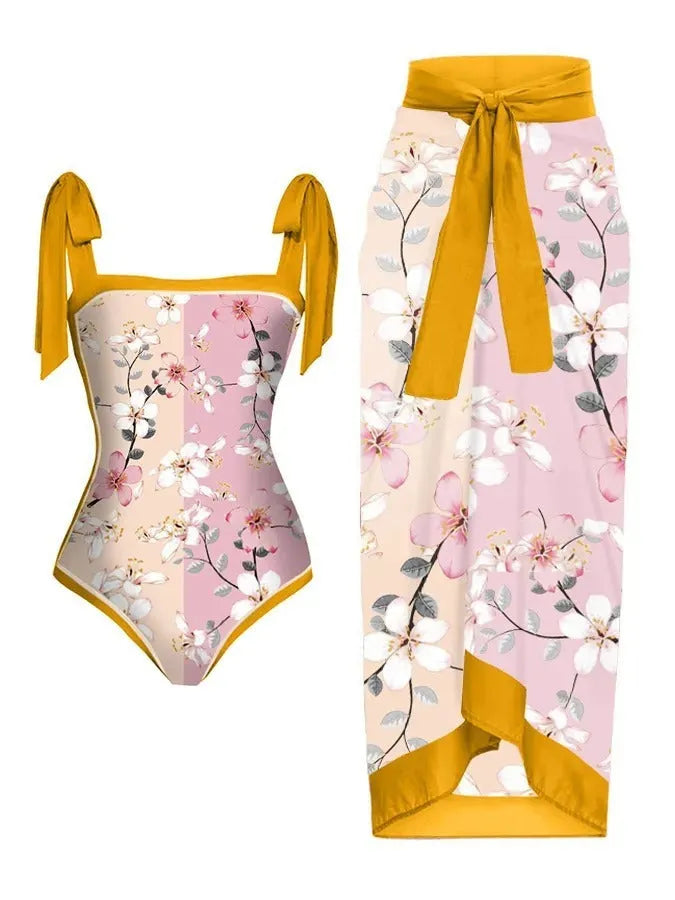 Women's printed floral chiffon swimsuit two-piece set with a matching skirt.