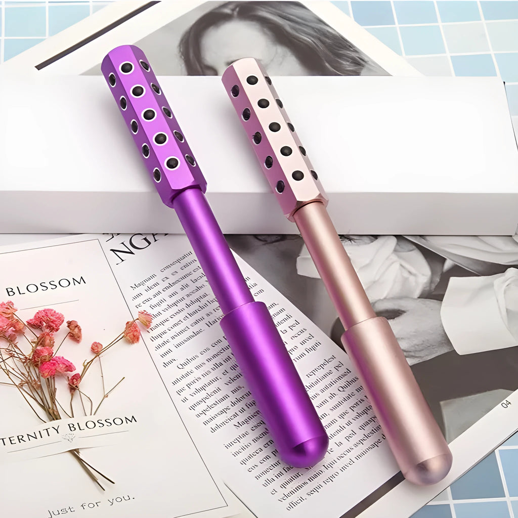 Purple handheld facial massage roller with germanium particles measuring 193mm long