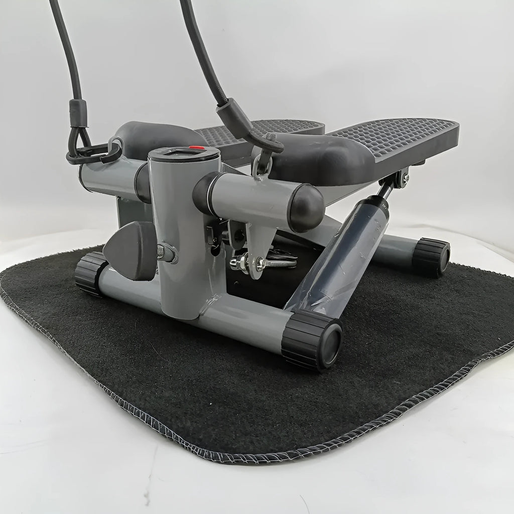 Silver grey household mini treadmill with hydraulic resistance system for waist slimming.
